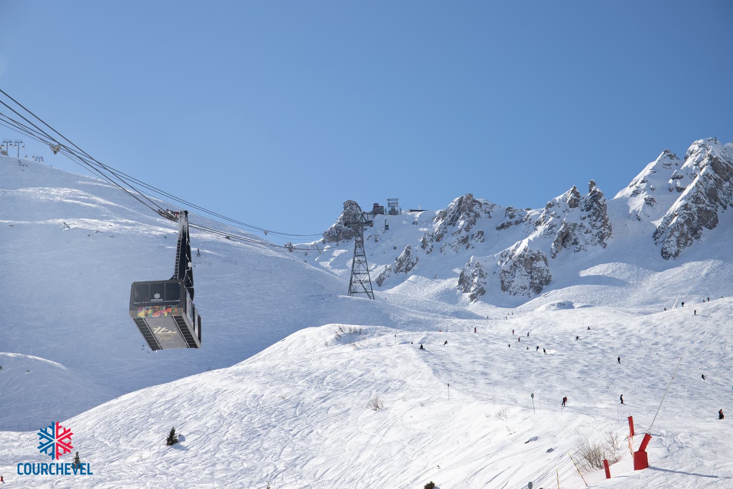 Gondola taking skiiers to top of french alps mountain